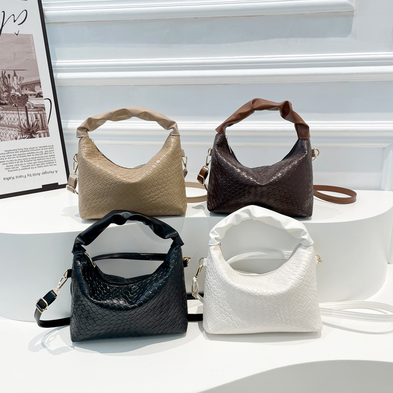 This is a new winter 2024 fashionable and simple solid-color handbag with a stylish and high-quality look. It's a single-shoulder crossbody bag and a dumpling bag full figure