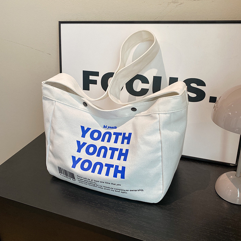 Casual large-capacity printed letter canvas 2024 winter trendy and personalized commuter single-shoulder crossbody tote bag for women full figure