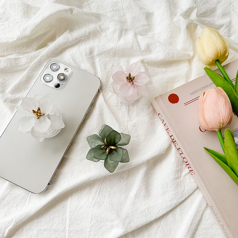 A fresh and clean InS-style flower-shaped phone airbag stand with a back sticker, a stretchable solid color lotus desktop support, portable details Picture