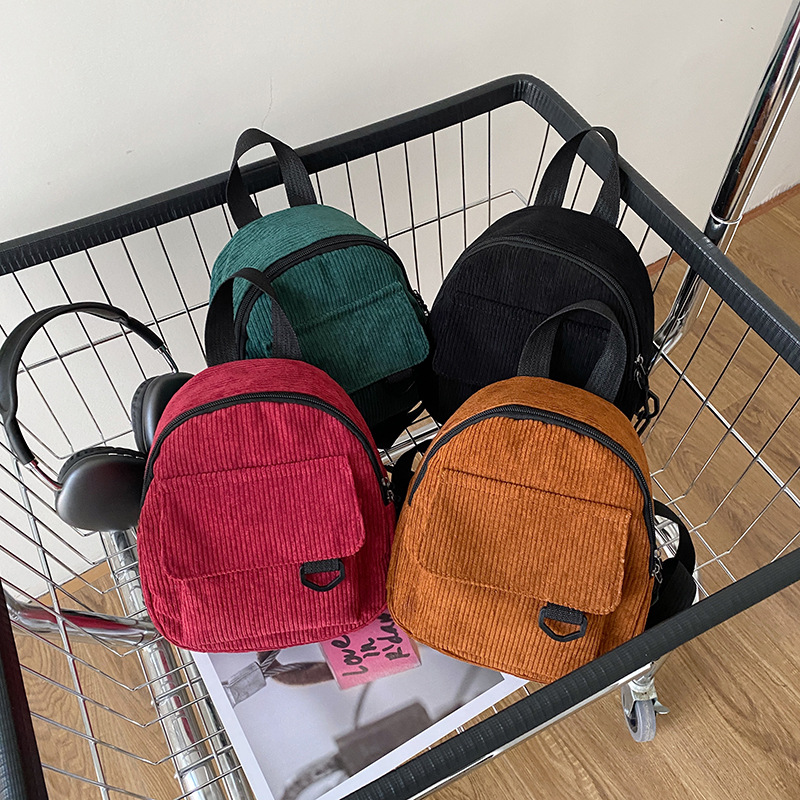 Korean-style casual, versatile, simple and retro corduroy solid color Japanese children's backpack, student schoolbag, women's backpack full figure