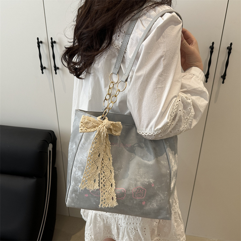 2025 New cute, stylish, trendy, simple and commuting texture printed single-shoulder underarm tote women's bag details Picture