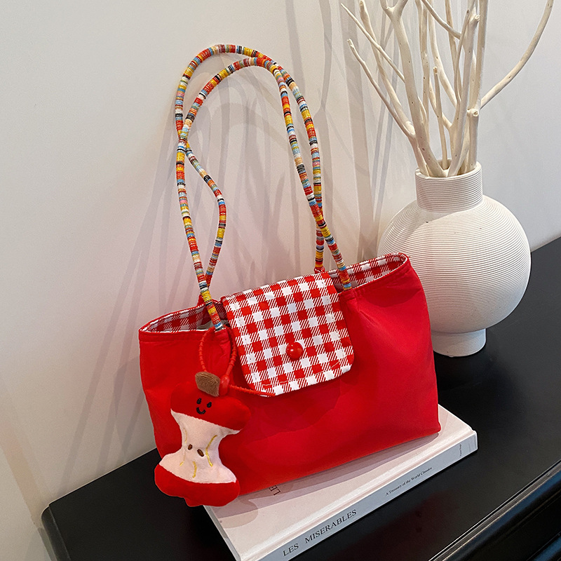 A portable and versatile denim mint small handbag with bottom straps on both sides - a large-capacity single-shoulder commuting bag full figure