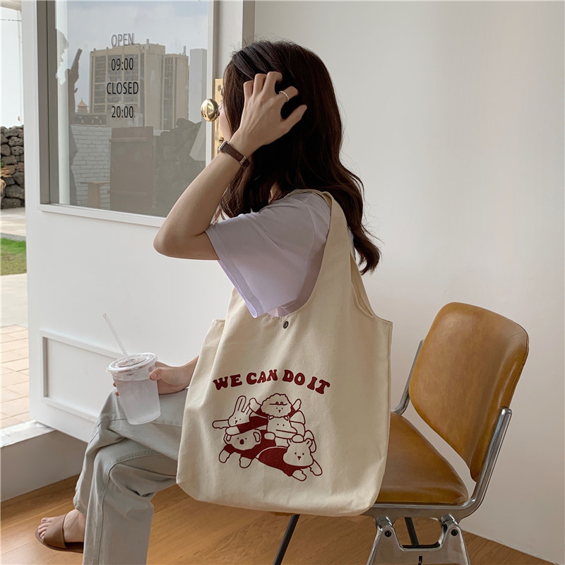 15134 canvas bag for women, Korean version, large-capacity underarm single-shoulder bag, simple and cute cartoon student handbag wholesale details Picture