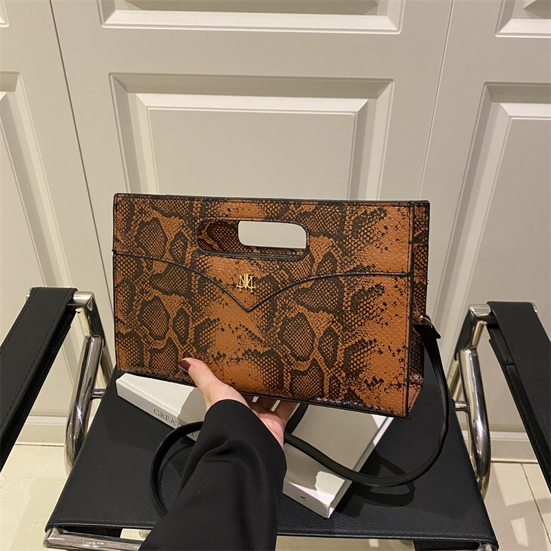 The 2025 new fashionable and trendy design, niche printed large-capacity tote bag, elegant hand-held shoulder crossbody bag for women full figure