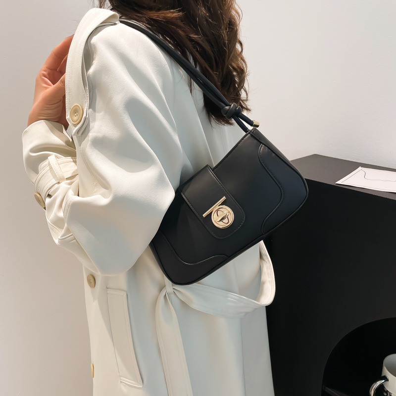 A trendy single-shoulder underarm bag with contrasting colors and a unique style for women's 2024 winter, featuring a stylish and individualistic crossbody crescent moon bag details Picture