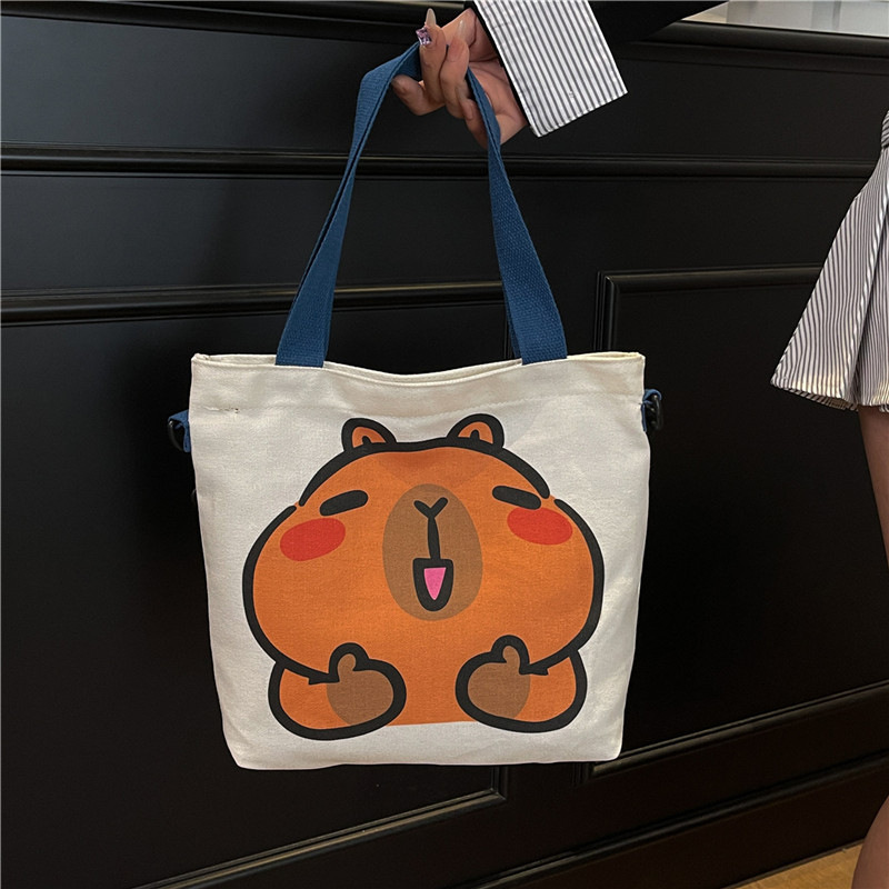 Wholesale of cross-border canvas bags for women, 2025 new style simple and fashionable cartoon printed single-shoulder bags and student tote bags full figure