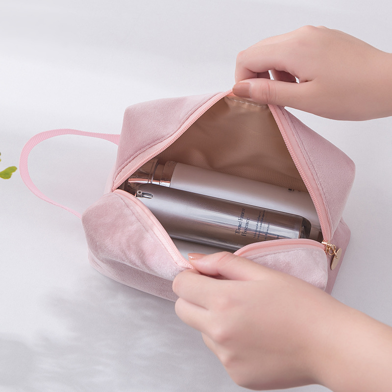 The InS-style waterproof makeup bag can be carried by hand. The flannel large-capacity simple toiletries bag is portable and easy to store Application Scenario
