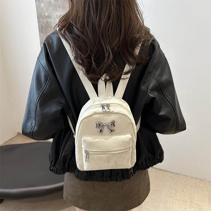 Bow backpack for women, a niche, casual and fashionable Korean girl bucket bag, a lightweight and small hand-held shoulder bag details Picture