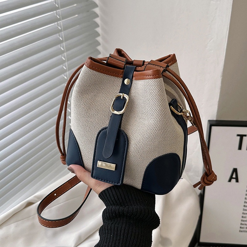 Cross-border foreign trade women's 2023 new Korean-style canvas patchwork color-blocking drawstring bucket bag with fashionable and niche design full figure
