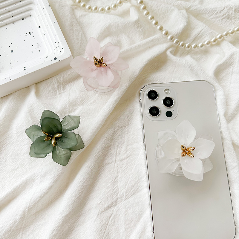 A fresh and clean InS-style flower-shaped phone airbag stand with a back sticker, a stretchable solid color lotus desktop support, portable full figure
