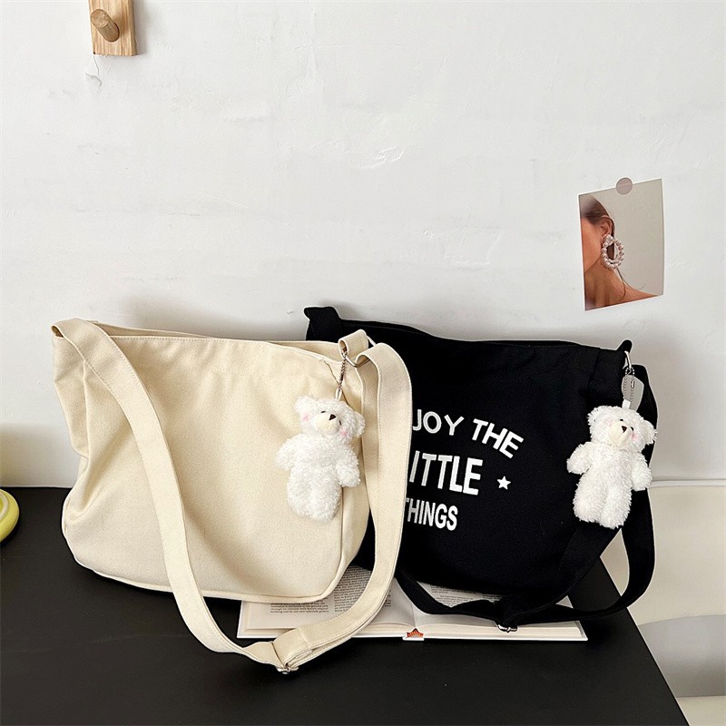 Large-capacity letter tote bag 2024 new solid color stylish hand-held canvas bag, fashionable and simple single-shoulder bag for cross-border details Picture