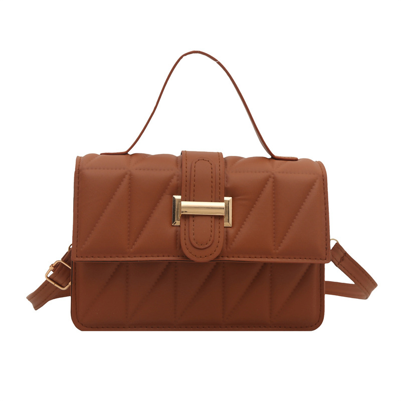 The new Korean version of the women's single-shoulder bag features a unique design. The underarm bag exudes a sense of high-end sophistication. It is a fashionable PU hand-held small square bag for women Item Picture