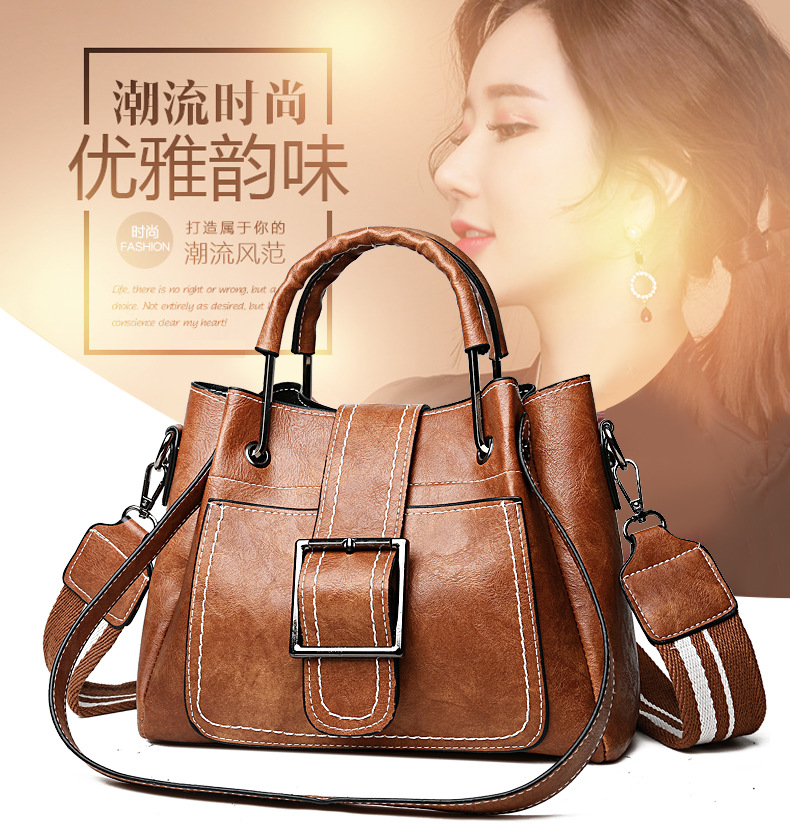 The manufacturer's best-selling 2021 new fashionable oil-leather pliers bag, iron handle thick wire bag, versatile European and American women's bag for export wholesale full figure