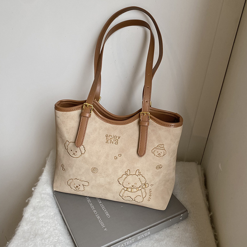 The large-capacity tote bag is a new fashion bag for women in 2025. It is a French niche single-shoulder crossbody bag and a versatile retro backpack details Picture