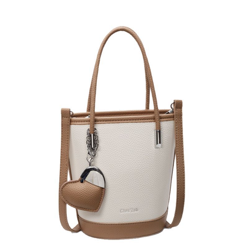 2025 New style fashionable lychee pattern high-end hand-held bucket bag for women's casual and versatile commuting solid color single-shoulder crossbody bag Item Picture