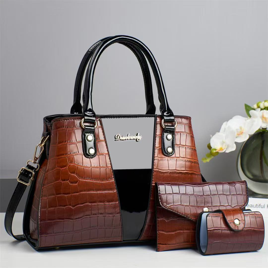This is a large-capacity, fashionable and versatile three-piece handbag set for women's trade. It features crocodile texture and embossed patterns, with a large capacity and a stylish look details Picture