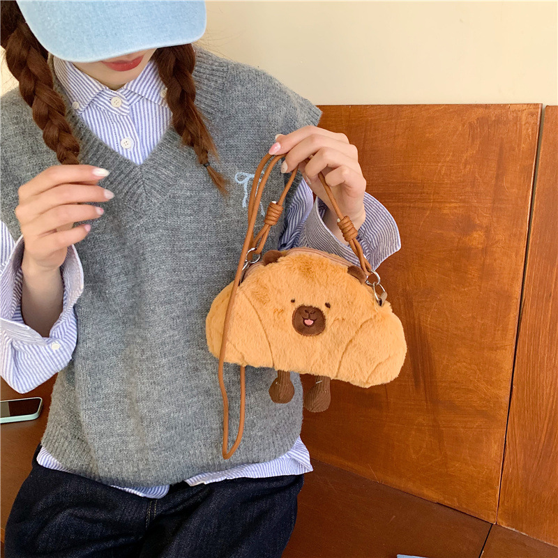 The new cartoon bread capybara mini crossbody bag is cute and girlish. The coin key bag and the claw machine doll can be exchanged for gifts details Picture