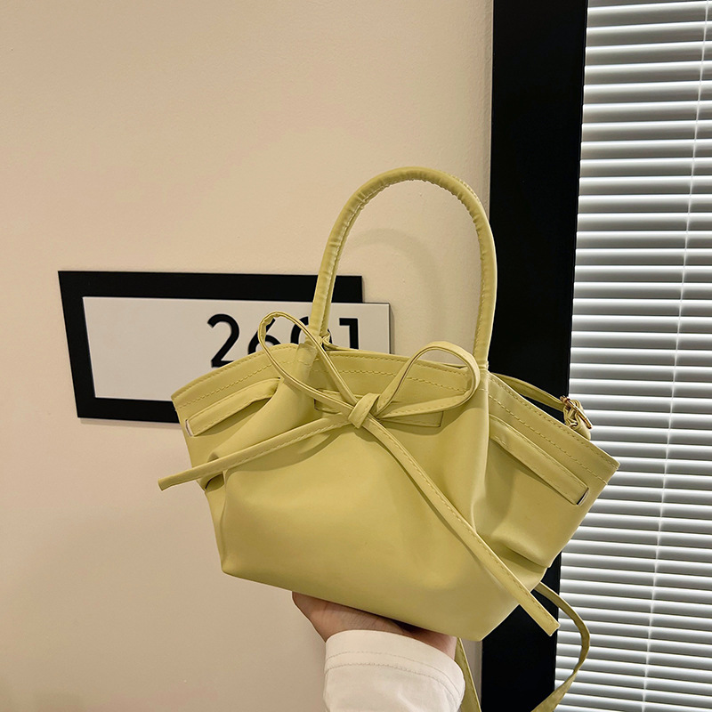 Korean niche hand-held vegetable basket bag for women's spring 2025 new trendy and fashionable bucket bag with bow crossbody full figure