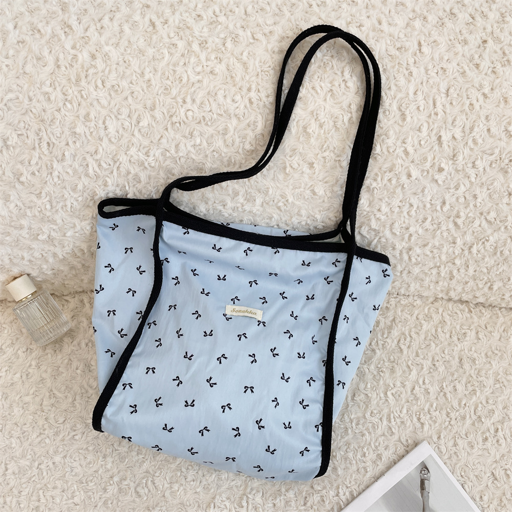 54104 Large-capacity bag, new spring and summer women's single-shoulder bag, casual and stylish bow commuter tote bag Application Scenario