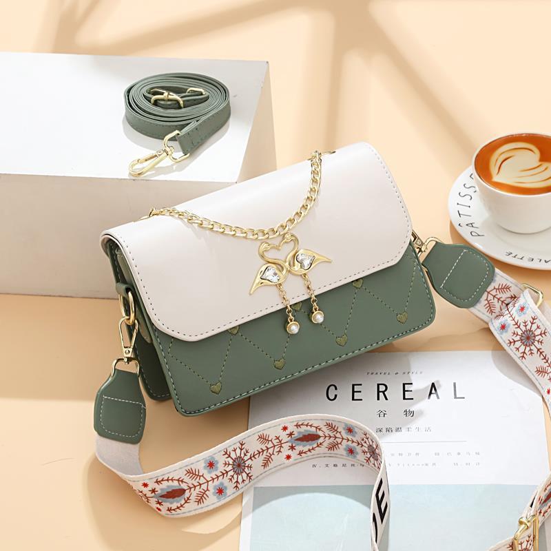 The new exquisite embroidered heart-shaped small square women's bag for autumn and winter is stylish and high-end. It's a one-shoulder crossbody bag with a swan color contrast details Picture