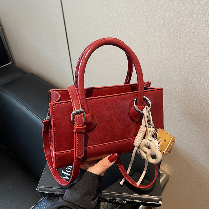 The Korean style Instagram simple and stylish small bag for women 2025, a new hand-held small square bag, is fashionable and versatile for commuting crossbody Specification drawing