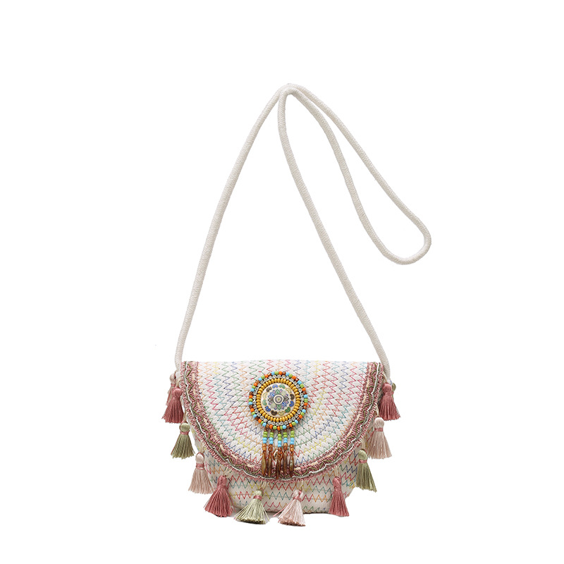 2025 New style simple ethnic style fashionable and trendy straw woven bag with tassel balls, simple crossbody shoulder bag Item Picture