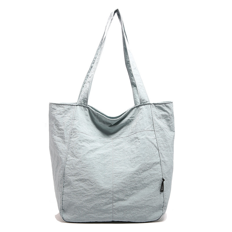 Simple nylon fabric bag, women's large-capacity trendy casual light shoulder bag, solid color versatile student commuting tote bag Item Picture