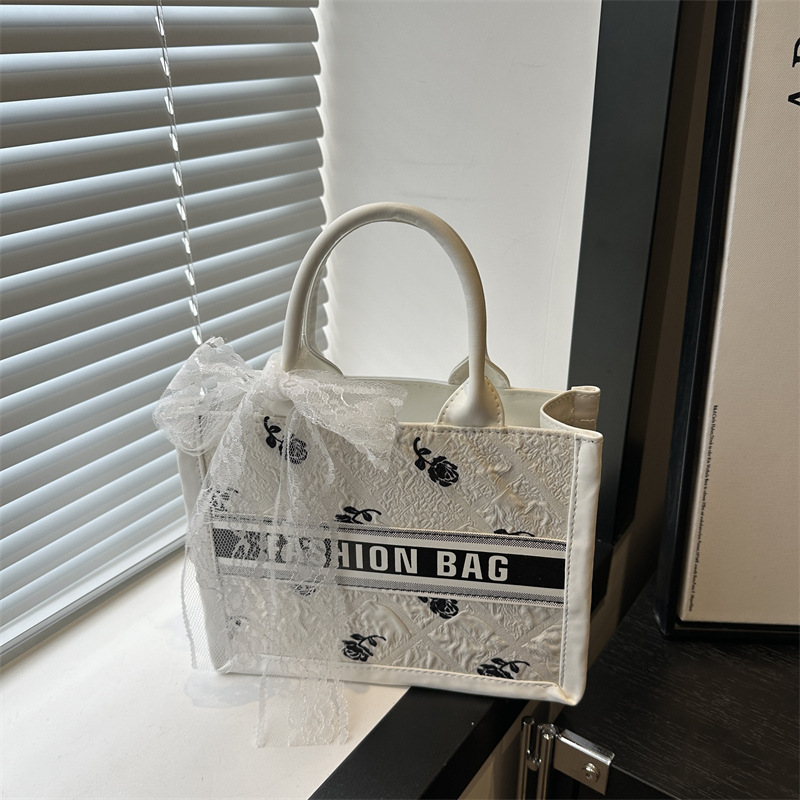 Large-capacity letter silk scarf single-shoulder bag 2025 Spring New style casual and stylish silk scarf bow hand-held tote bag full figure
