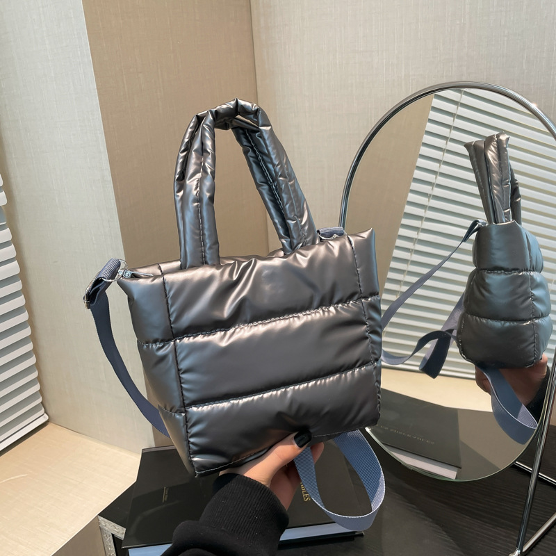 A cute and versatile winter cotton-padded jacket bag, a fashionable and individual hand-held cream puff bag, and a single-shoulder crossbody bucket bag full figure