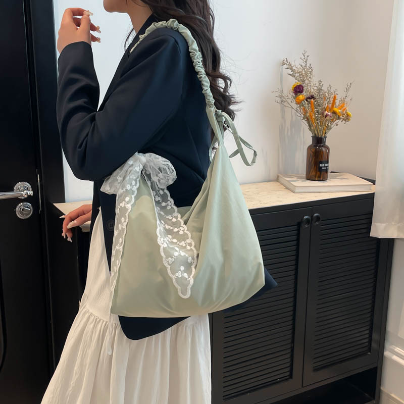 Large-capacity versatile tote bag for women, new spring/Summer 2025 canvas bag for commuting, simple solid color single-shoulder crossbody bag details Picture
