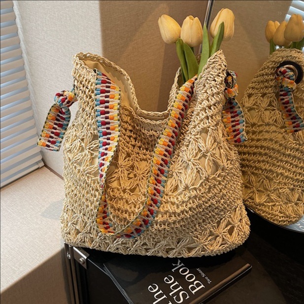 Lazy style straw woven large-capacity bucket bag for women, a new trendy and fashionable hollowed-out single-shoulder crossbody bag for the summer of 2025 full figure