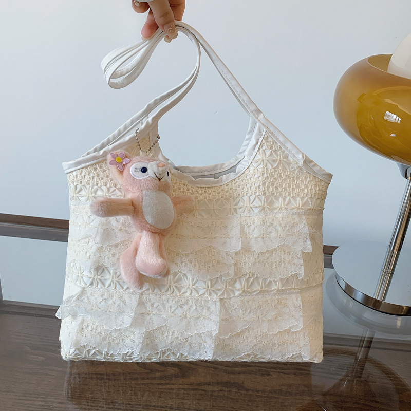 The 2025 new large-capacity tote bag is cute and versatile, fashionable and adorable. It is a lace underarm bag and a commuting single-shoulder bag full figure