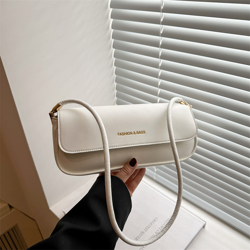 A high-end retro small square bag for women 2025, a trendy and niche hand-held shoulder and underarm bag for commuting full figure