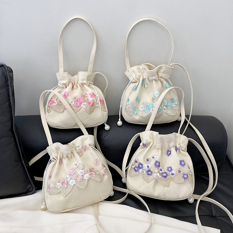2024 New style simple nylon embroidered flower hand-held commuter bucket bag, Chinese-style single-shoulder crossbody bag Application Scenario