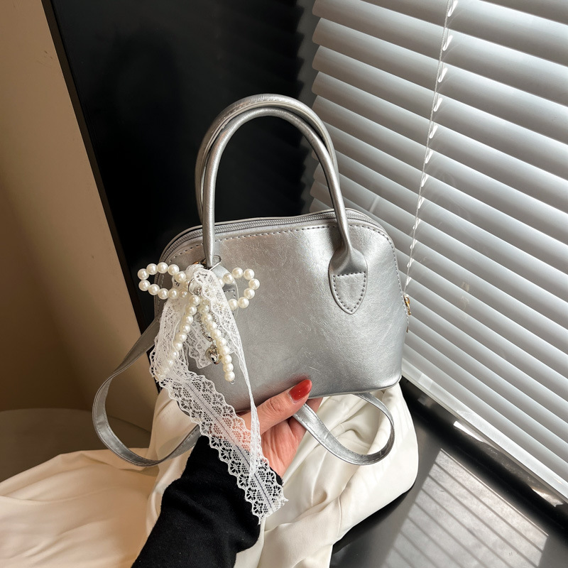 Korean version hand-held bowling bag for women 2025 new style, fashionable and simple pillow bag, versatile and casual single-shoulder crossbody bag full figure