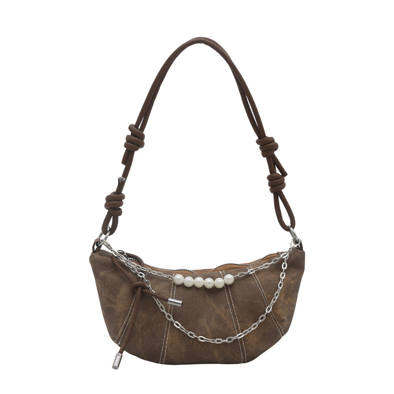 The new Korean version retro and fashionable horn bag, with a niche design and a trendy style, is a versatile and high-end crossbody bag for women Item Picture