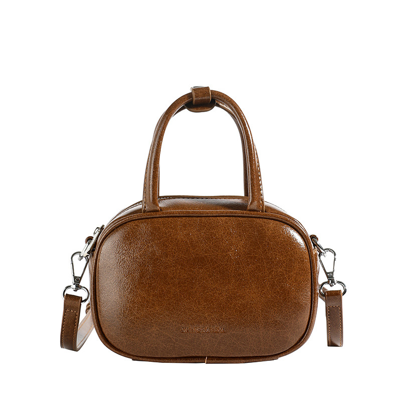 High-end soft leather bowling bag for women, 2024 new style, trendy, simple and fashionable handbag, elegant commuting crossbody bag Item Picture