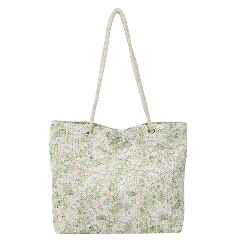 The new spring style simple, casual and versatile tote bag made of trendy grass and floral prints is a trendy commuting bag for women Item Picture