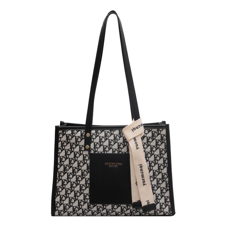 A large-capacity women's 2025 new versatile commuter single-shoulder bag with a fashionable, high-end texture and a retro tote bag Item Picture