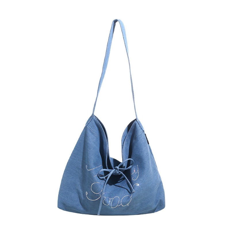 A niche design, fashionable, large-capacity, trendy canvas bag for women 2025, a new stylish casual commuting single-shoulder crossbody bag Item Picture