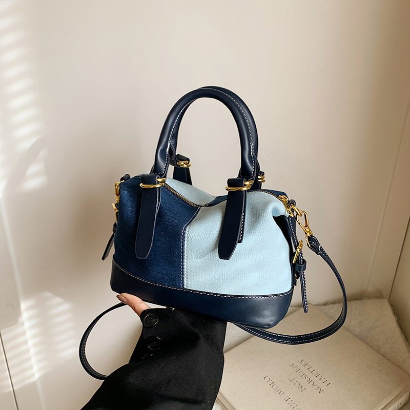 A multi-color denim blue bag for women, a new 2024 fashionable hand-held shoulder bag with a niche design and a casual crossbody bucket bag details Picture