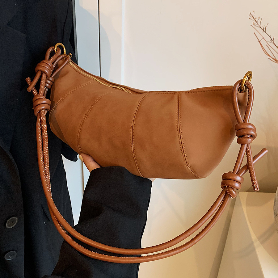 A niche retro matte suede bag for women, 2024 new versatile design, knot-style single-shoulder crossbody bag, horn bag full figure