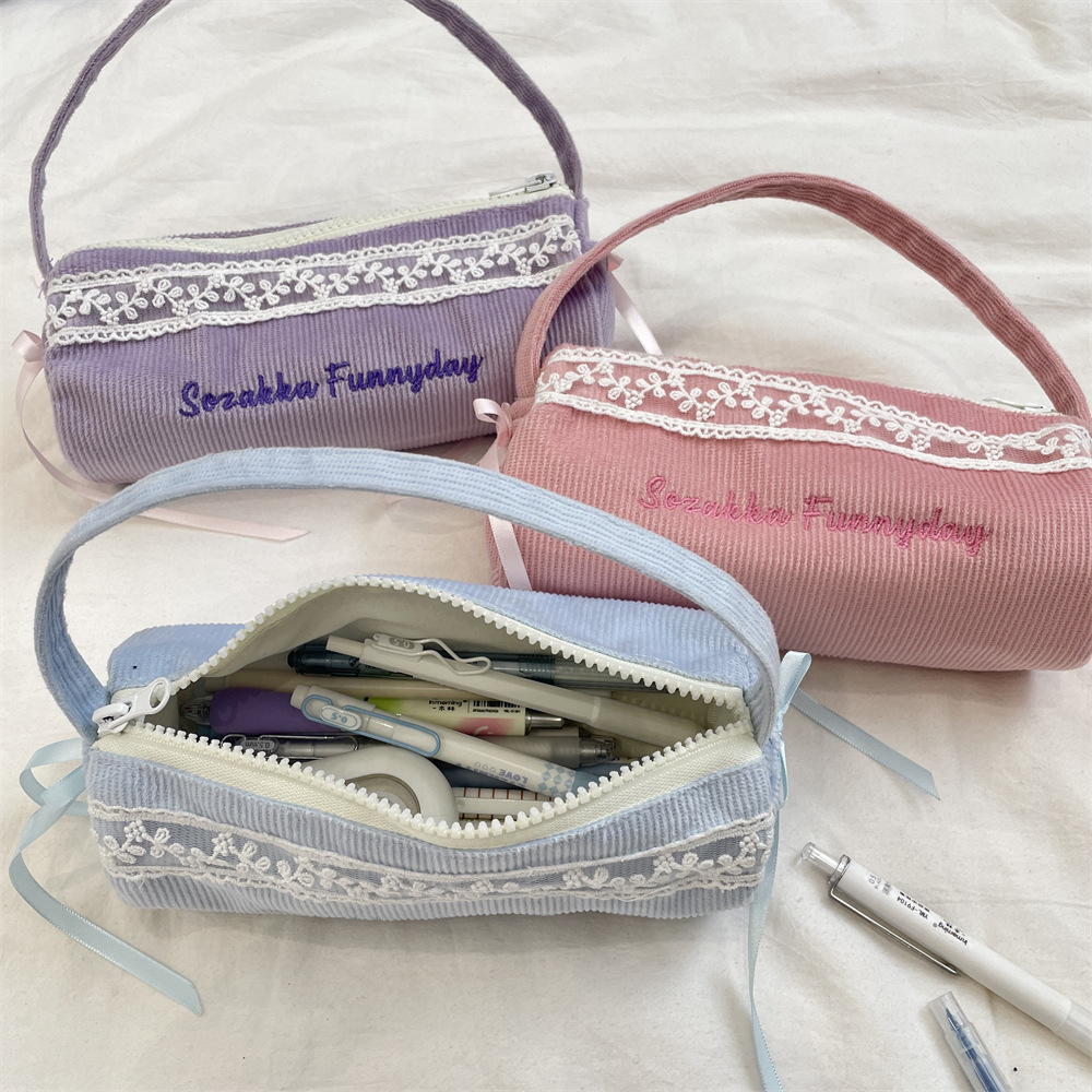 53273 Hand-held pen case, simple and fresh pen holder, student stationery storage bag, large-capacity fabric stationery pen case Application Scenario