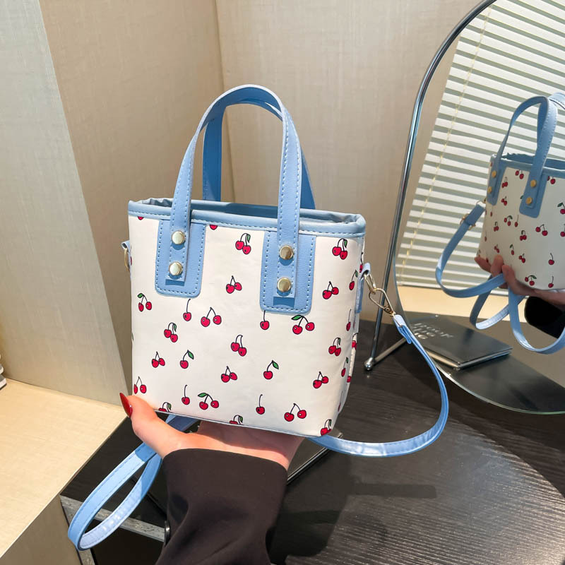 Large-capacity, cute commuting single-shoulder tote bucket, cross-border 2025 new cherry hand-carry fashionable handbag full figure