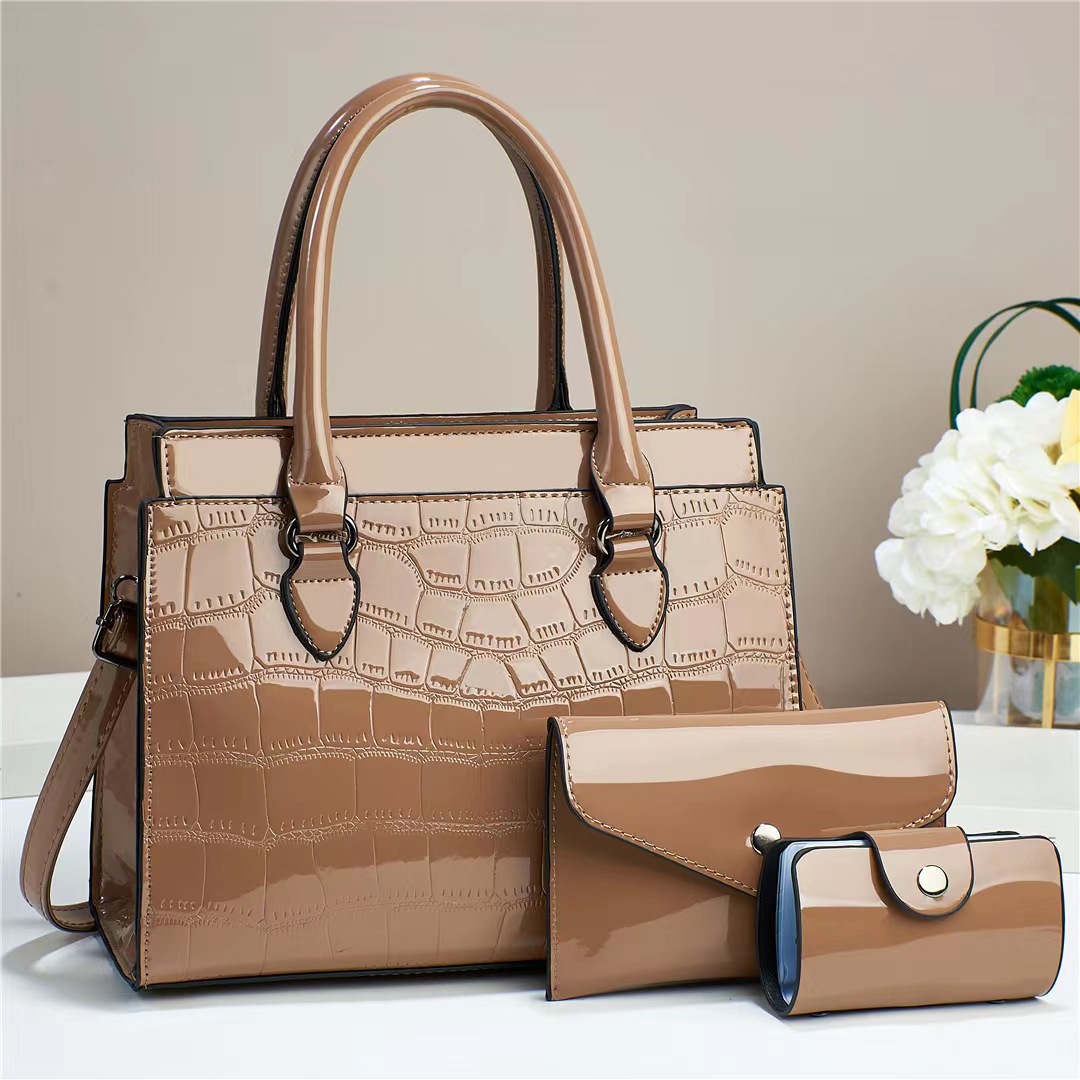 This is a stylish and elegant handbag for women, featuring a 2023 new style of shiny leather three-piece set. It is a spacious and large-capacity single-shoulder crossbody bag Application Scenario