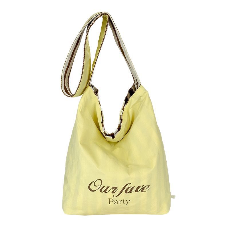 Fashionable letter striped double-sided canvas bag for women, 2025 new Korean-style ins casual tote bag, single-shoulder bucket bag Item Picture