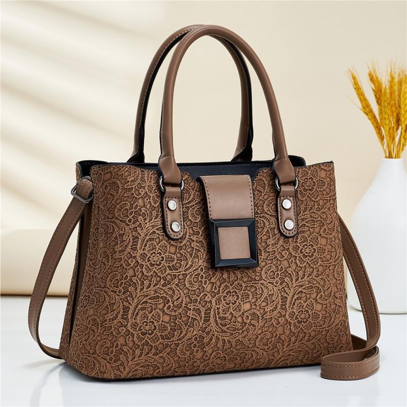 Wholesale of women's bags 2022 new style embossed bags, European and American fashion lace pattern single-shoulder hand-carry crossbody bags, export consignment full figure