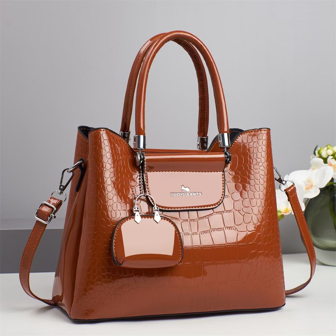 The new women's handbag from foreign trade features a trendy and retro texture. It is a large-capacity casual and versatile crossbody bag with a fashionable and elegant style full figure