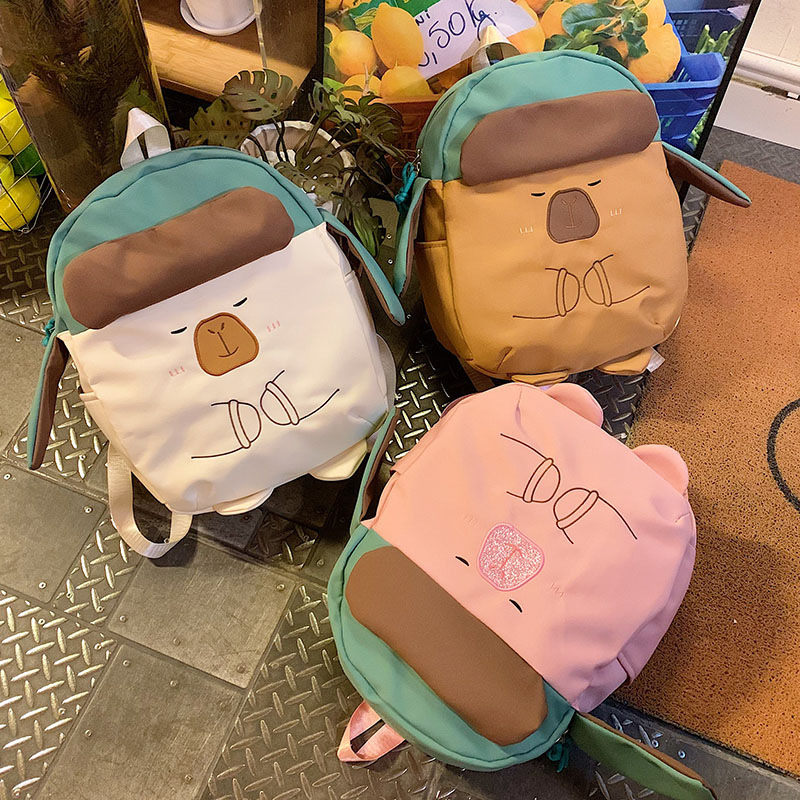 Cartoon creative hat capybara backpack, cute Capybara large-capacity class backpack, campus storage schoolbag full figure