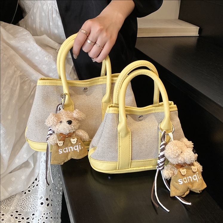 The 2025 new stylish color-blocking large-capacity hand-held bucket bag is a simple, casual and versatile commuter single-shoulder crossbody bag for women full figure